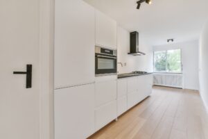 Pretty kitchen with hardwood parquet flooring